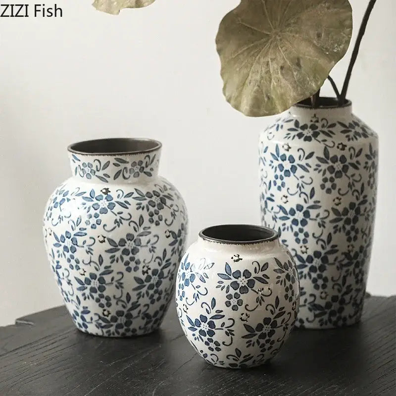 Set of three blue white porcelain ceramic vases with floral patterns and rustic finish for living room decorbites decor