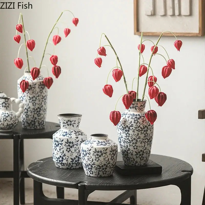 White porcelain vase with blue floral patterns holding red lantern flowers for decorbites blue white hydroponic use