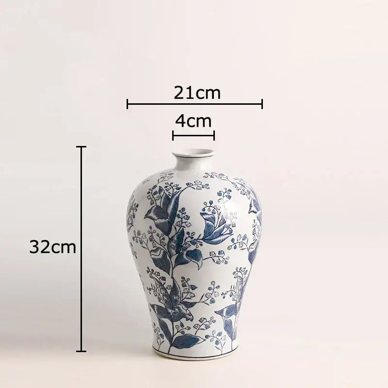 A classic white porcelain vase with intricate blue floral and bird motifs for decorbites blue white living room decor