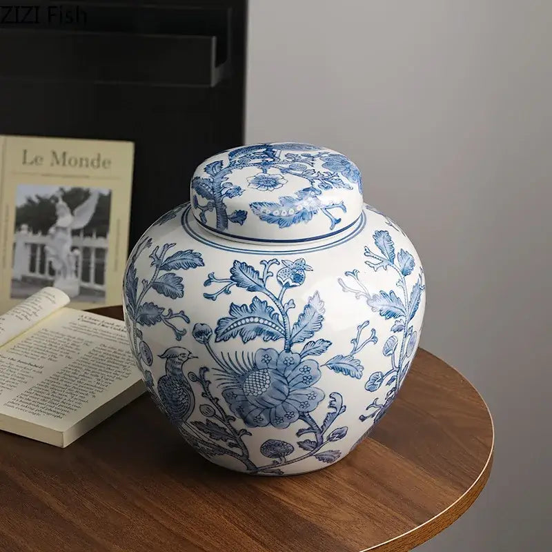 A classic blue white porcelain vase with intricate floral and bird motifs and matching lid for living room decorbites decor