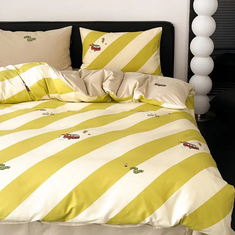 Yellow and cream striped duvet cover set with embroidered red camper vans complementing a blue and white striped cover set