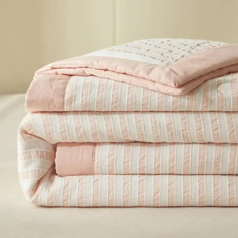 Soft pink and cream striped jacquard summer quilt with embroidered border made from soya fibre by decorbites