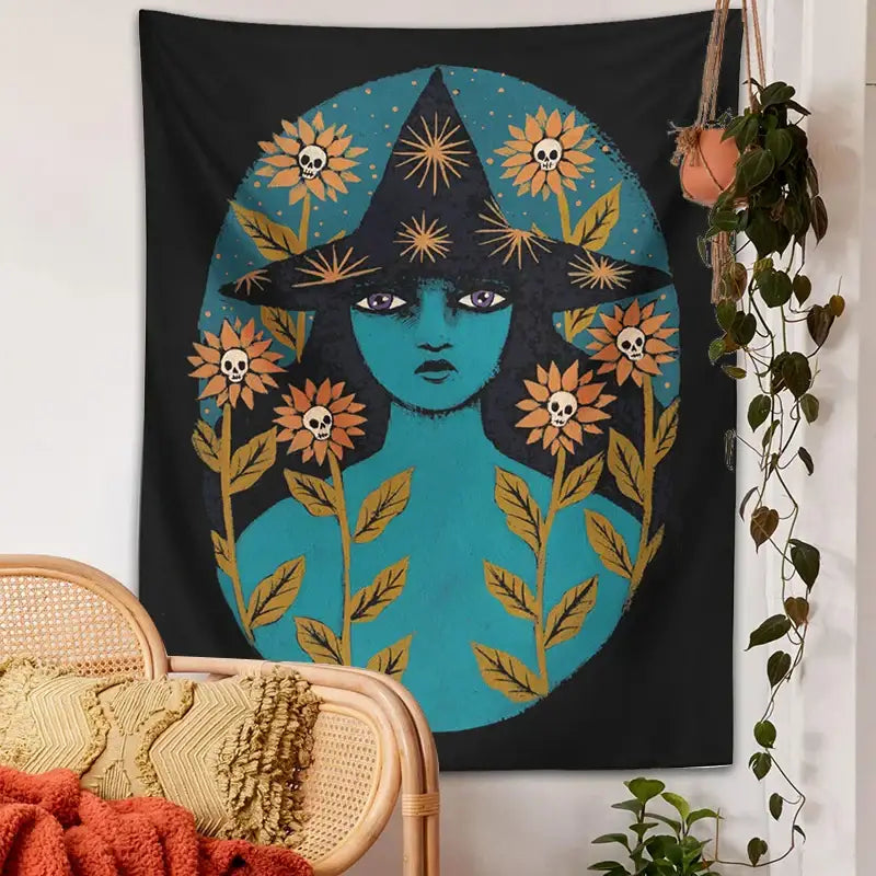 A black blue witches botanical tapestry featuring a stylized teal-skinned witch with sunburst hat and orange floral skulls
