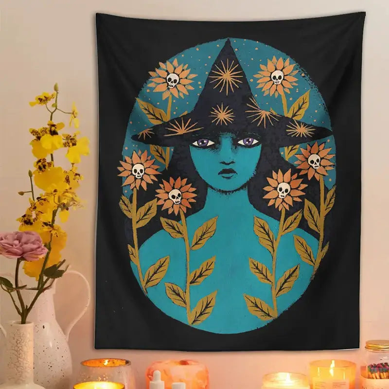 Black tapestry featuring a teal-skinned witch in a black hat with sunburst patterns and orange skull flowers blue witches botanical