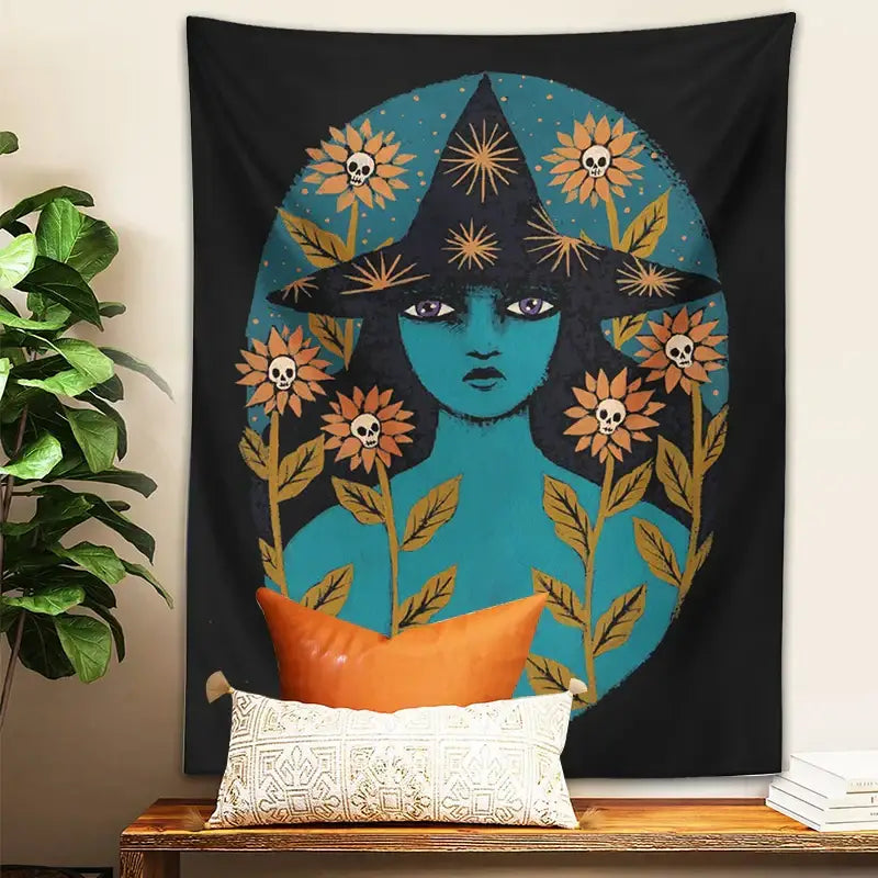 Black tapestry featuring a teal-skinned witch with a black pointed hat and orange floral skull decorbites blue witches wall art
