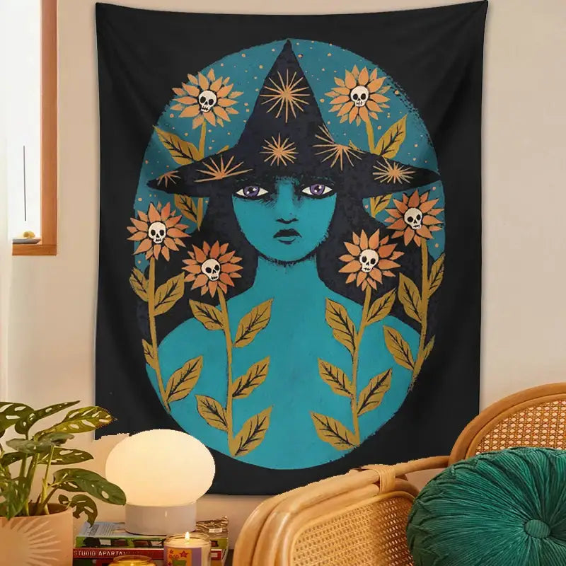 A black blue witches botanical tapestry featuring a teal-skinned witch with a gold sunburst hat and orange floral skull decorbites wall art