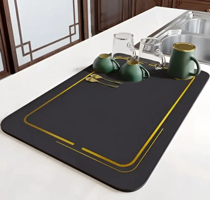 Black rectangular dish drying mat with gold trim and decorative lines for dining table mat decorbites dining table use