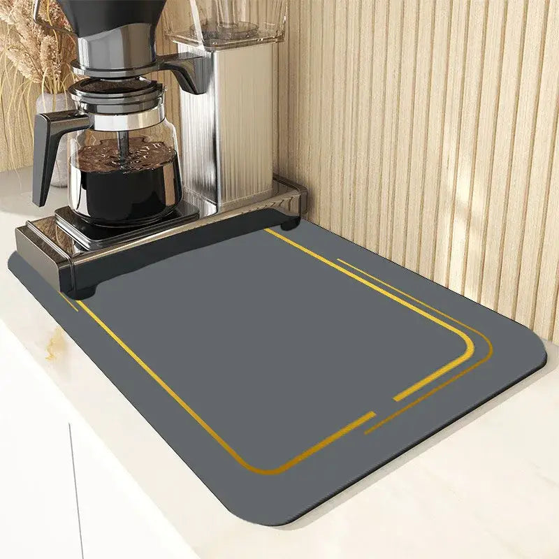 Gray rectangular dining table mat with gold border placed under coffee maker from decorbites dining table set