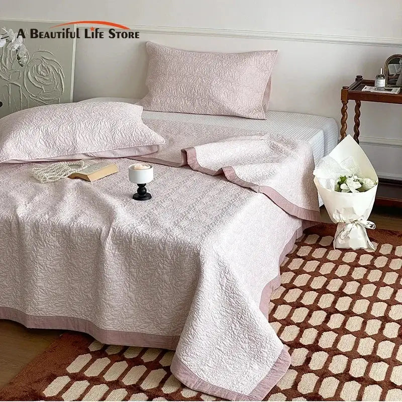Blush pink decorbites cotton quilted bedspread set with matching pillowcases and subtle textured pattern for bedroom decor