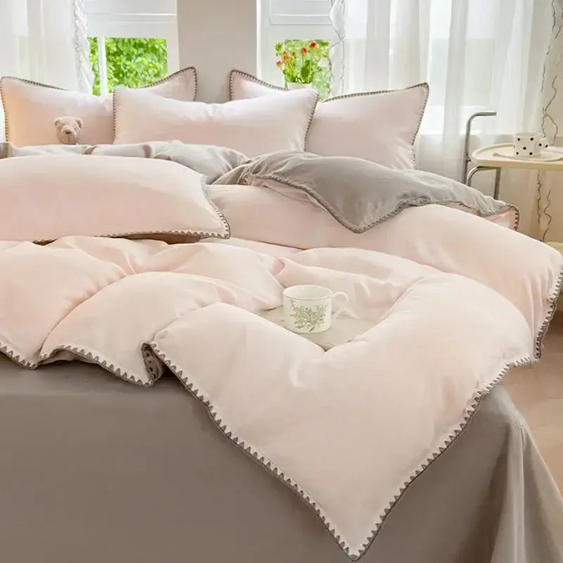 Blush pink and gray cotton bedding set with zigzag stitch cover and cozy layered duvet and matching pillows