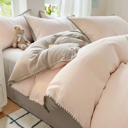 Blush pink and gray cotton edge embroidery bedding set with soft quilted cotton edge and subtle zigzag stitch trim