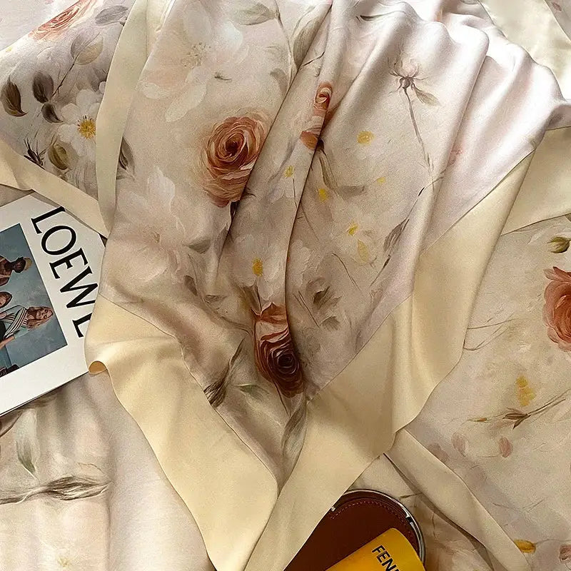 A soft cream-colored silk scarf with blush rose and muted green eucalyptus fiber flowers for bedding set decorbites