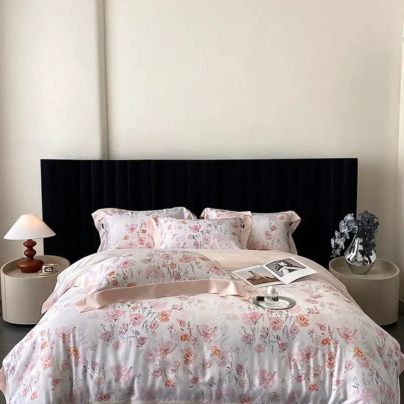 Pink floral patterned satin bedding set with decorbites eucalyptus fiber flowers and matching pillowcases and sash