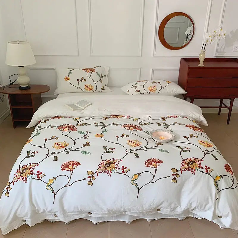 White cotton duvet cover with intricate red orange green floral embroidery from decorbites cotton bohemia bedding set