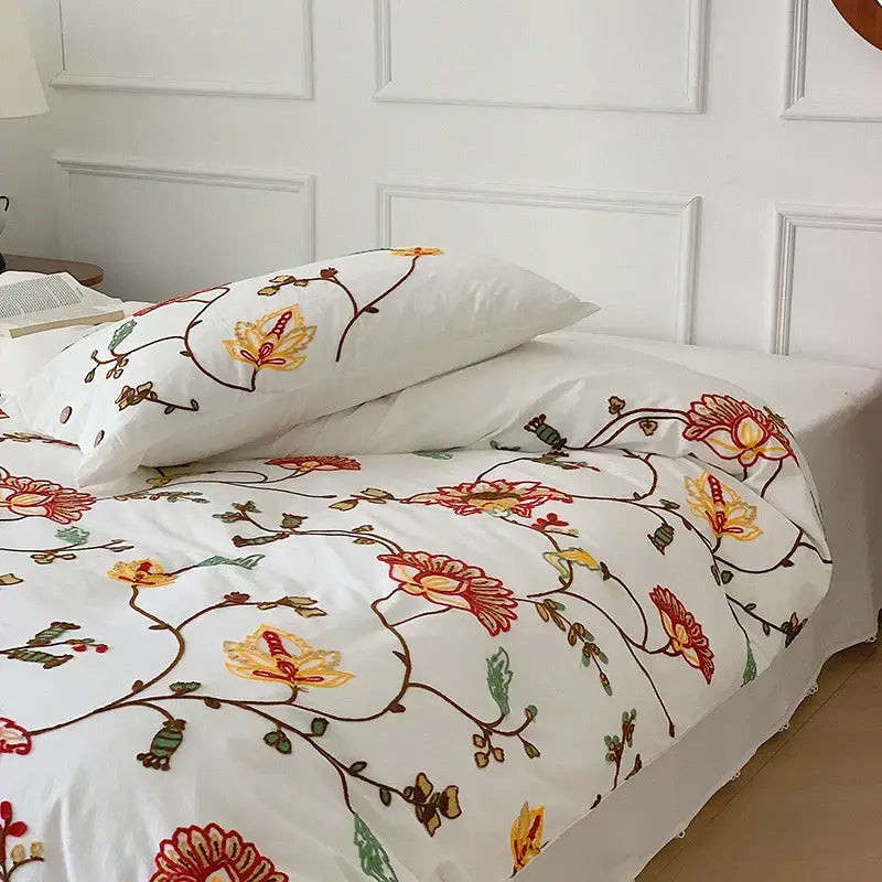 White cotton duvet cover with intricate red yellow and green floral embroidery in decorbites cotton bohemia bedding set