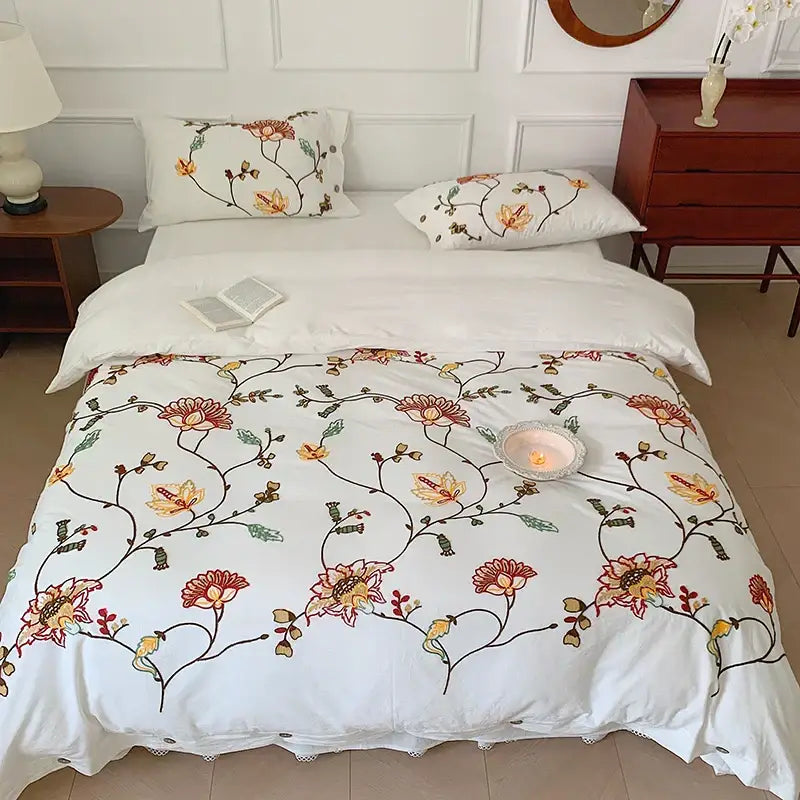 White cotton duvet cover bedding set with intricate orange red and green floral embroidery by decorbites cotton bohemia
