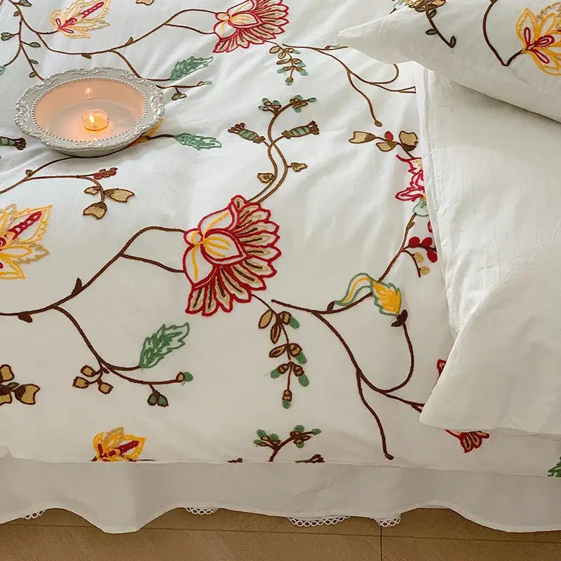White cotton duvet cover bedding set with intricate red yellow green and brown floral embroidery by decorbites cotton bohemia