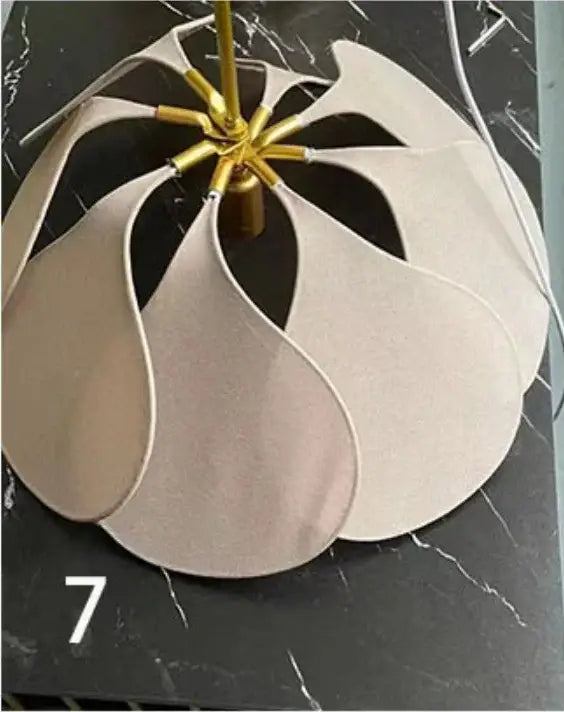 Beige petal-shaped bohemia linen e27 pendant light with gold-toned fixture for bedroom decor by decorbites bohemia linen