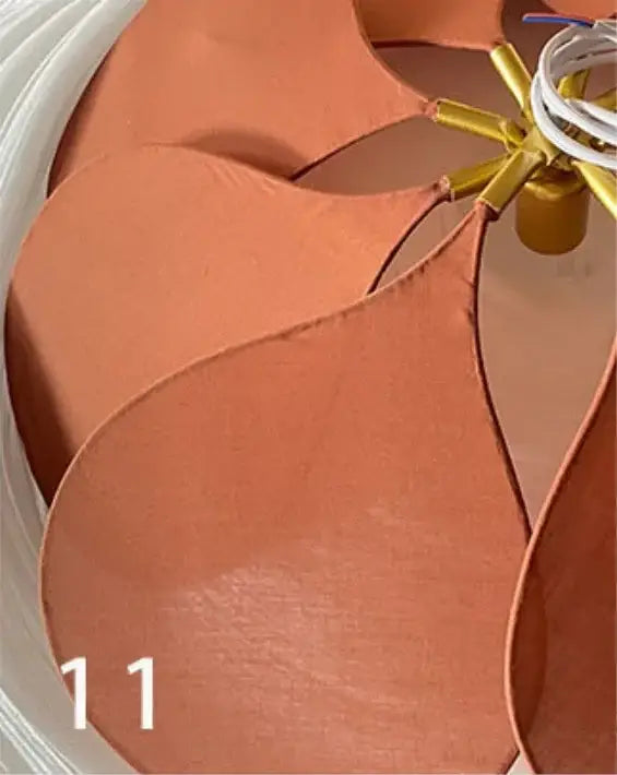 Tan leather fan blades with golden hub and white wiring in decorbites bohemia linen e27 cream flower pendant light