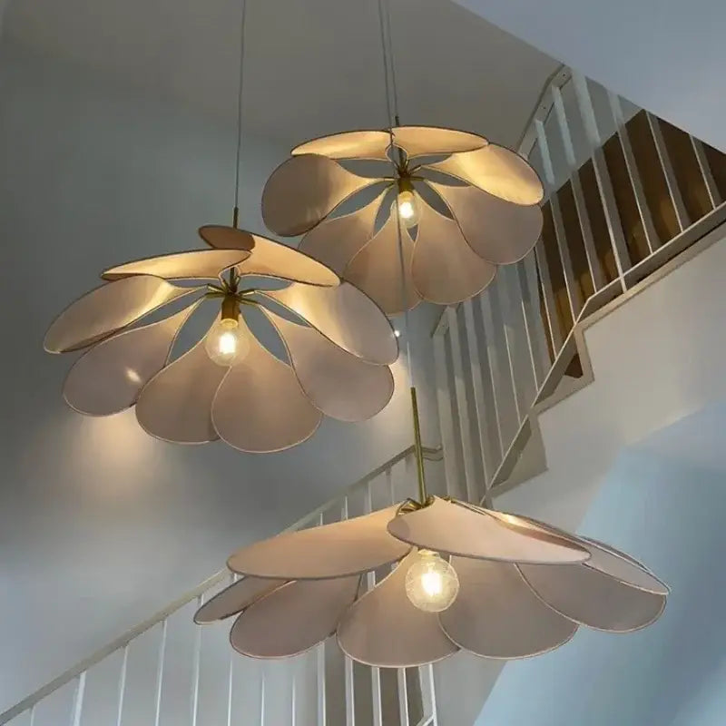 Three cream-colored bohemia linen e27 flower pendant lights with metallic stems hang from ceiling for bedroom decor