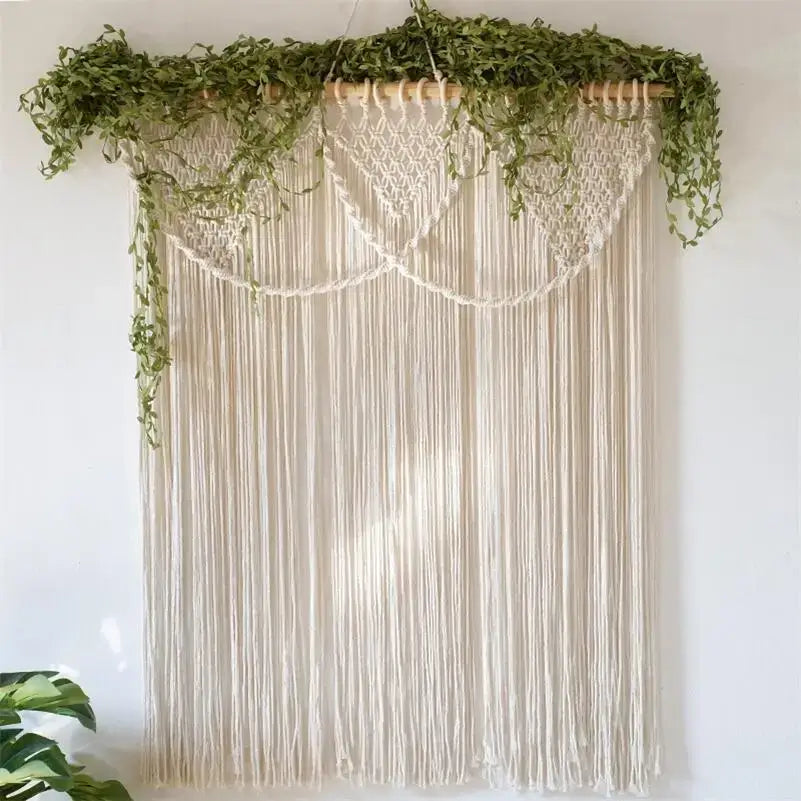 Cream-colored decorbites bohemia macrame cotton curtain with cascading fringe and leafy vines on wooden rod wall hanging