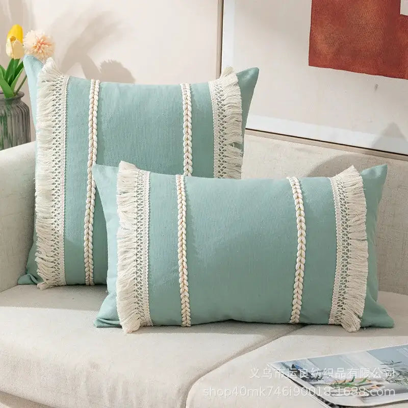 A pair of light teal rectangular cushion covers with cream braided fringe decorbites bohemia tassel living room decor