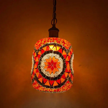 Bohemia turkish mosaic hanging sconce featuring a vibrant orange and red glass tile pendant with starburst design