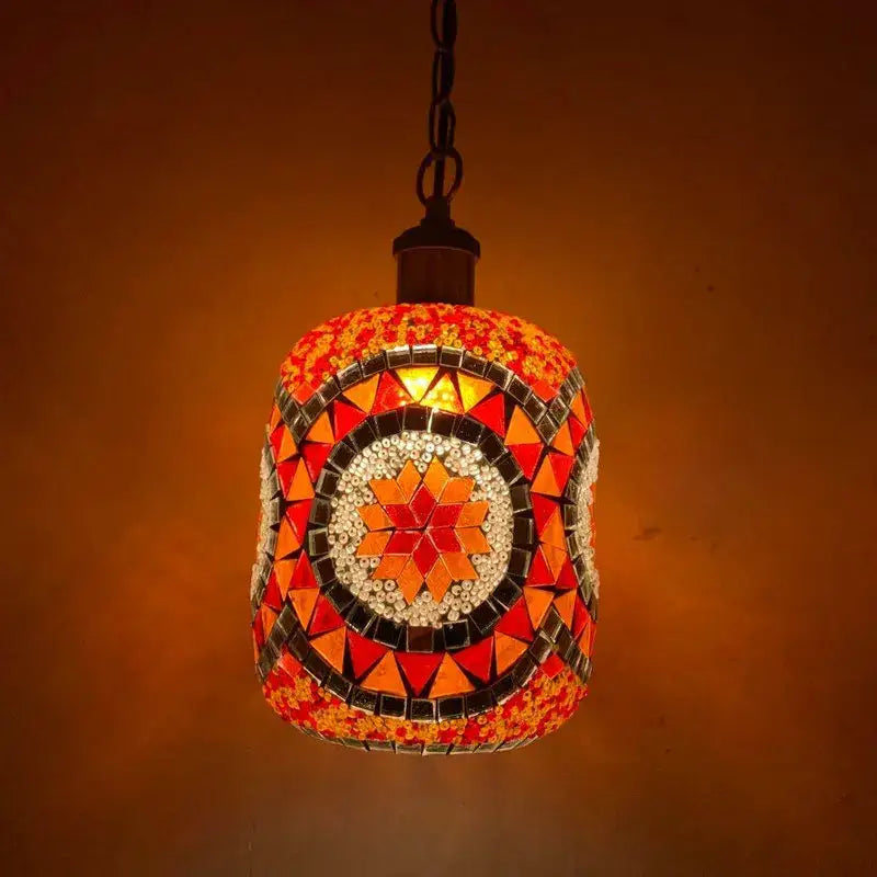 Bohemia turkish mosaic hanging sconce featuring a vibrant orange and red glass tile pendant with starburst design