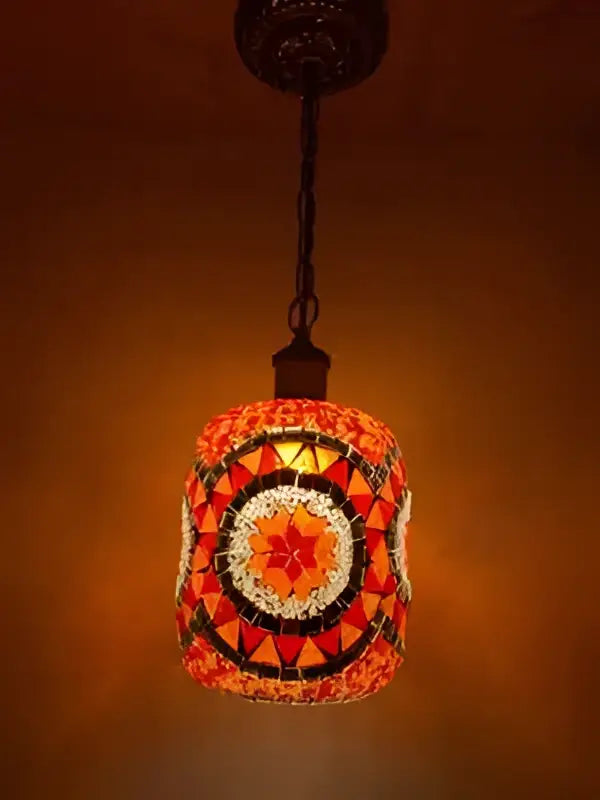 Bohemia turkish mosaic hanging sconce with a vibrant orange and red cylindrical glass shade for bedroom lighting
