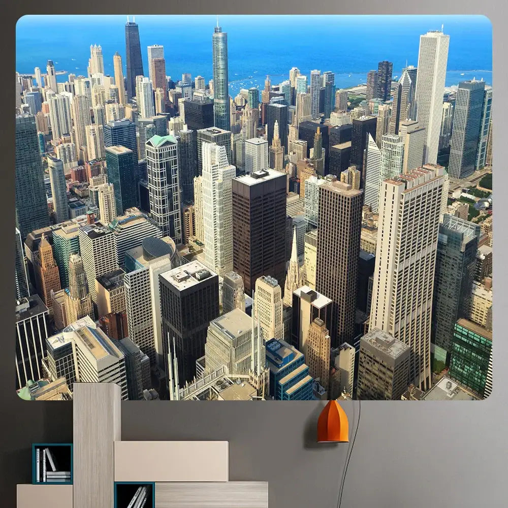 A vibrant orange pendant lamp beside a modern shelving unit under a decorbites bohemian art tapestry cityscape blanket