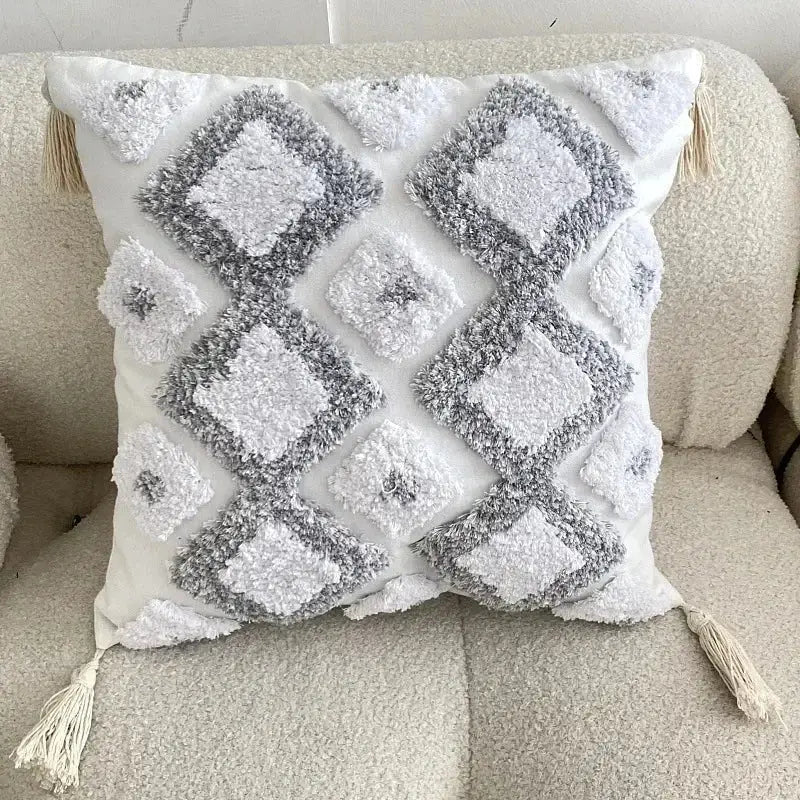 Bohemian beige and brown tufted cushion cover with white and gray diamond texture and cream bohemian tufted tassel decorbites pillow