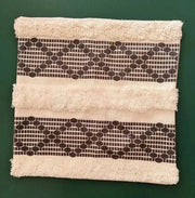 Beige towel with frayed edges and dark brown geometric bands for decorbites bohemian tufted cushion cover pillow