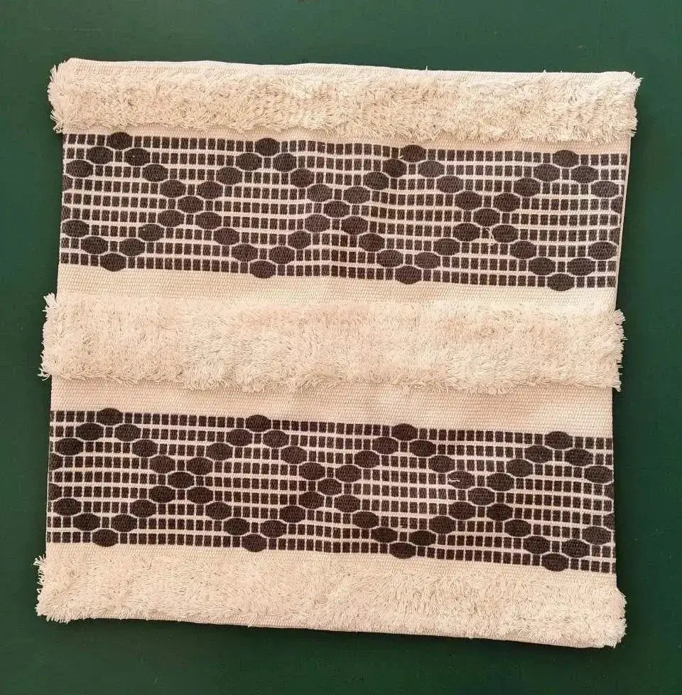 Beige towel with frayed edges and dark brown geometric bands for decorbites bohemian tufted cushion cover pillow