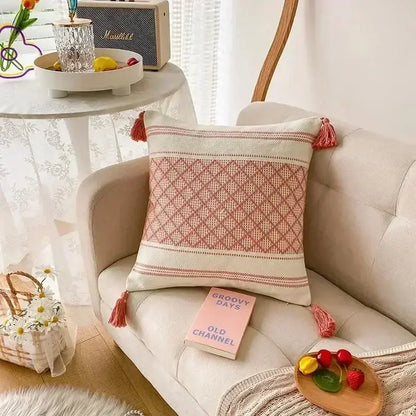 Bohemian beige and brown tufted cushion cover with cozy cream and dusty rose woven fabric and bohemian tufted tassel accents