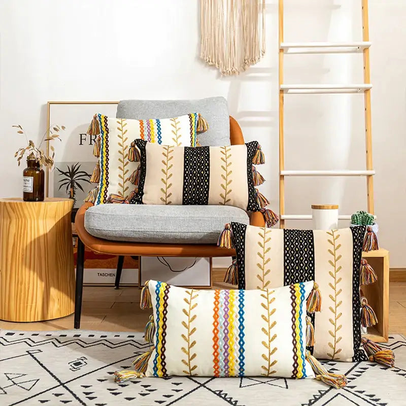 Beige and black bohemian cotton embroidery cushion cover with colorful stripes gold leaf patterns and tassels decorbites decor