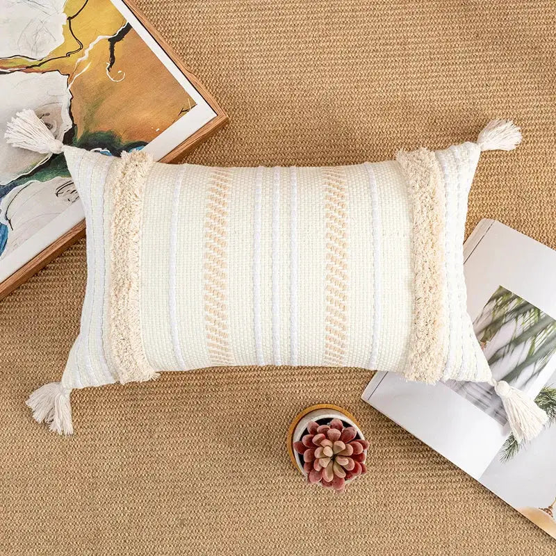 Cream-colored bohemian beige cushion cover with textured woven stripes and tasseled fringes for living room decorbites