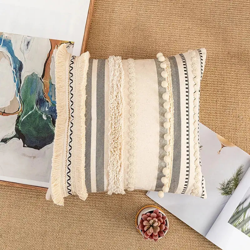 Bohemian beige cushion cover with beige and gray stripes, textured fringe, pom-poms, and woven details for decorbites bohemian beige throw pillow decor