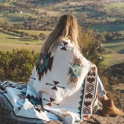 Bohemian sofa blanket by decorbites featuring a cozy off-white woven fabric with vintage plaid geometric patterns and fringed edges