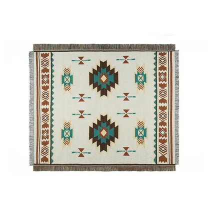 Beige woven bohemian sofa blanket with teal brown geometric tribal patterns and fringed edges vintage plaid design decorbites