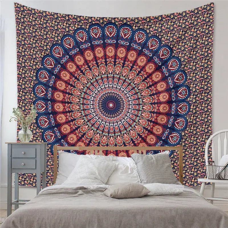A vibrant circular mandala tapestry yoga mat with paisley patterns in deep red blue and gold for decorative tapestry yoga