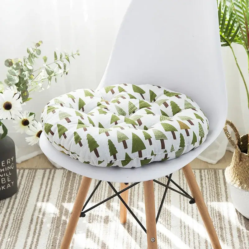 Round plush meditation cushion pouf with white base and green pine tree pattern for bohemian living room decor