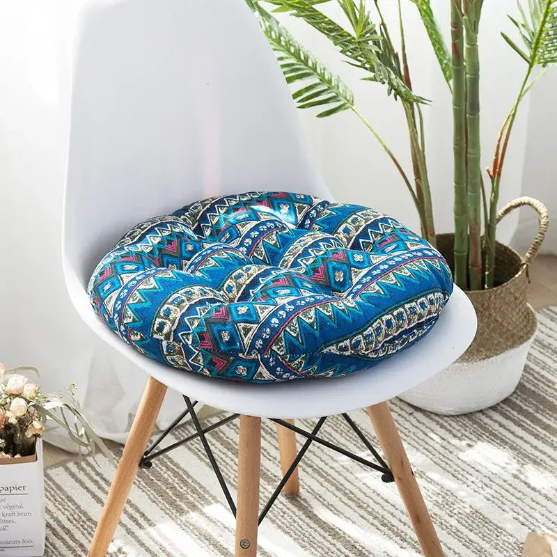 Bohemian blue patterned meditation cushion pouf with geometric and tribal-inspired designs in living room decor