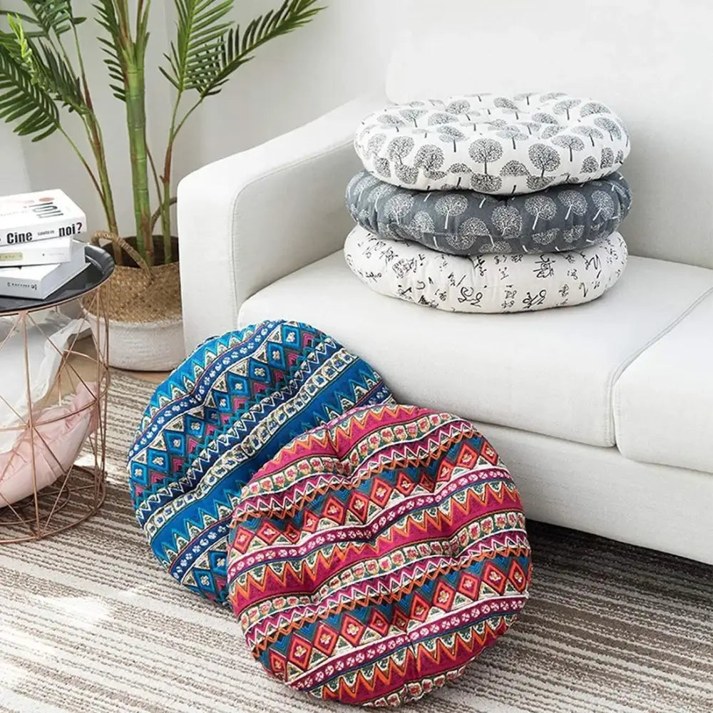 Round cushioned meditation cushion pouf with vibrant blue, pink, gray geometric and tree patterns for living room use