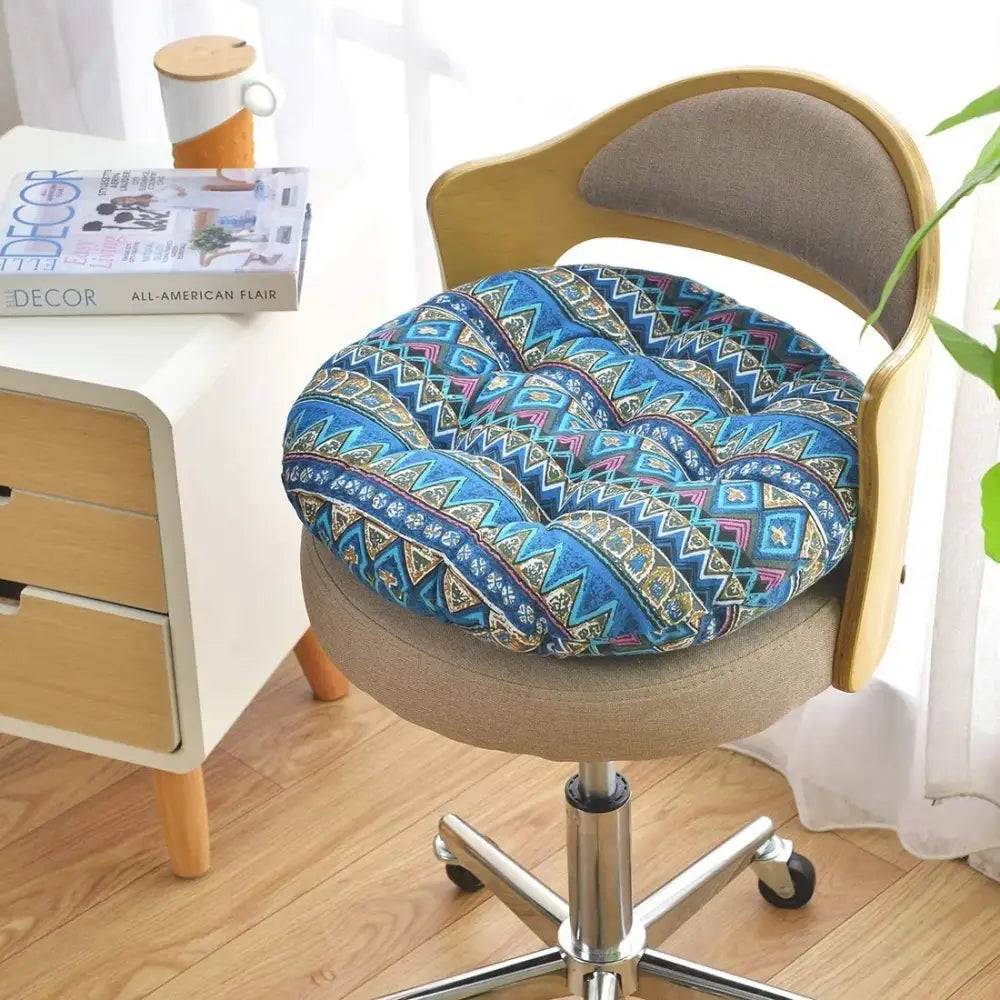 Bohemian blue green and red geometric meditation cushion pouf with blue patterned cushion featuring pink and gold designs