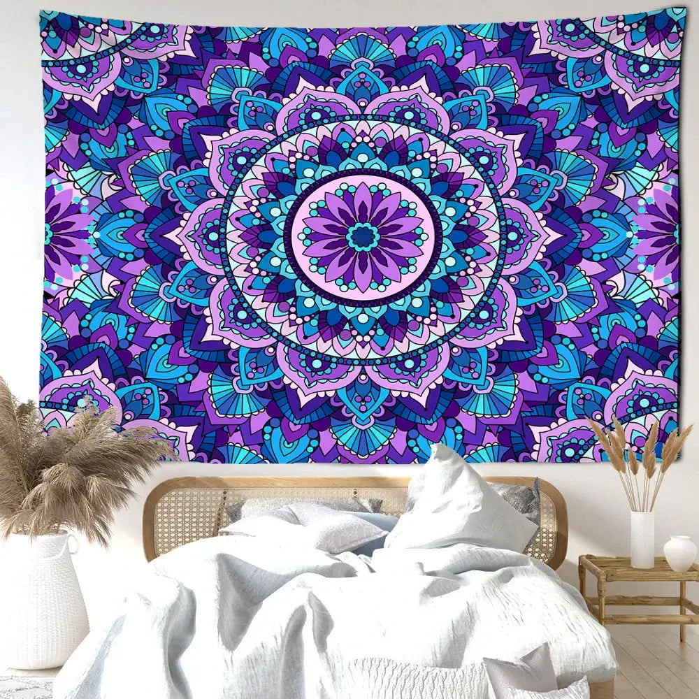 Bohemian blue purple mandala tapestry with intricate symmetrical patterns hanging above a bedroom bed wall hanging