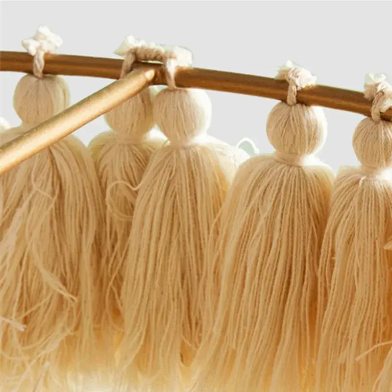 Beige cotton tassels with knotted tops hanging from wooden rod in decorbites bohemian chandelier tassel light suspension light