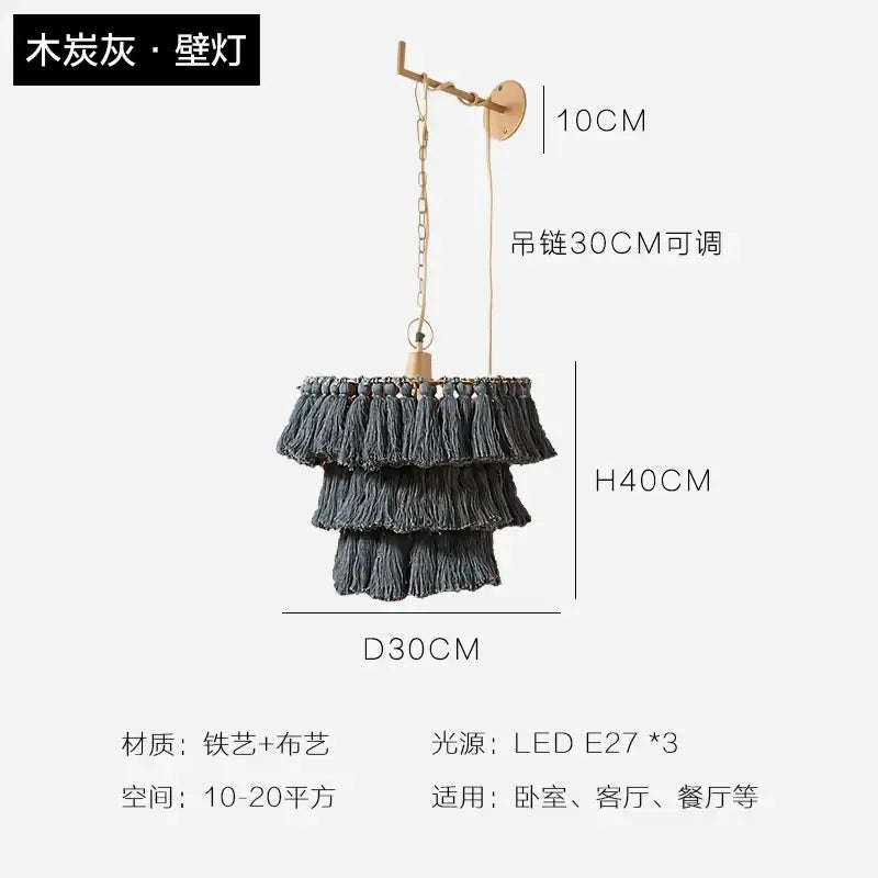 A tiered charcoal gray tassel light with brass-finished metal frame and chain for decorbites bohemian chandelier suspension light