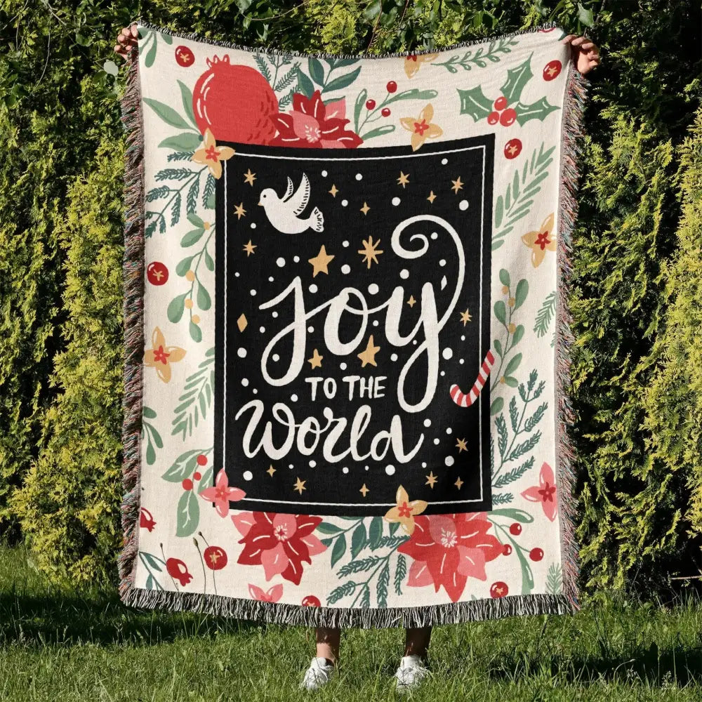 Festive cream woven decorbites bohemian camping blanket with black joy to the world panel and holiday floral decor