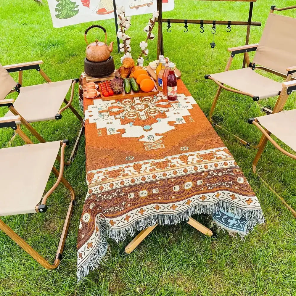 Orange and cream patterned woven decorbites bohemian camping blanket with fringe edges for living room throw use
