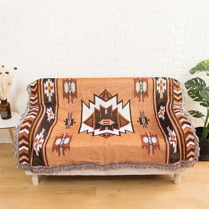 Tan and brown geometric-patterned throw blanket with fringe edges featuring bohemian classic design thread decorbites style